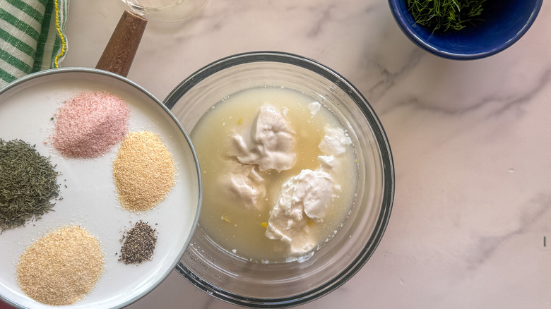 adding spices to dressing