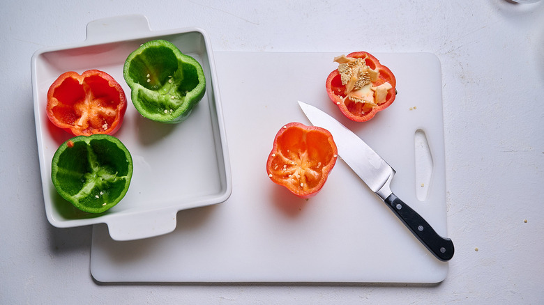slicing the seeds and stem out of bell peppers