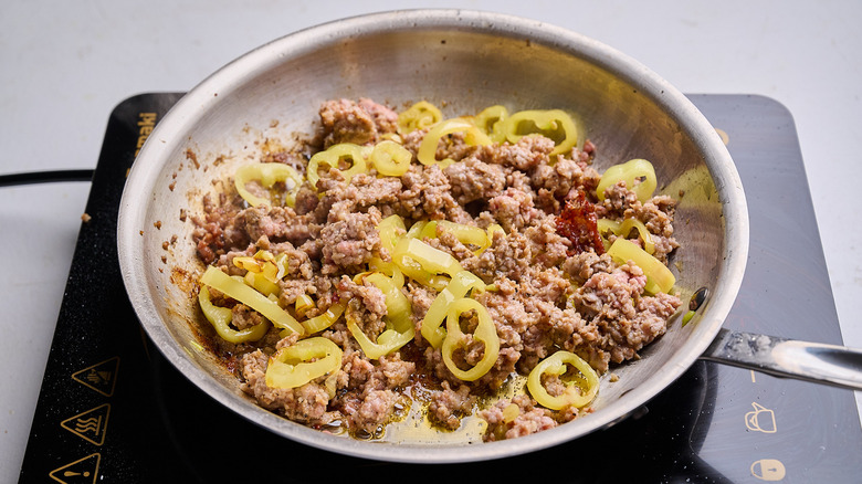 banana pepper added to skillet