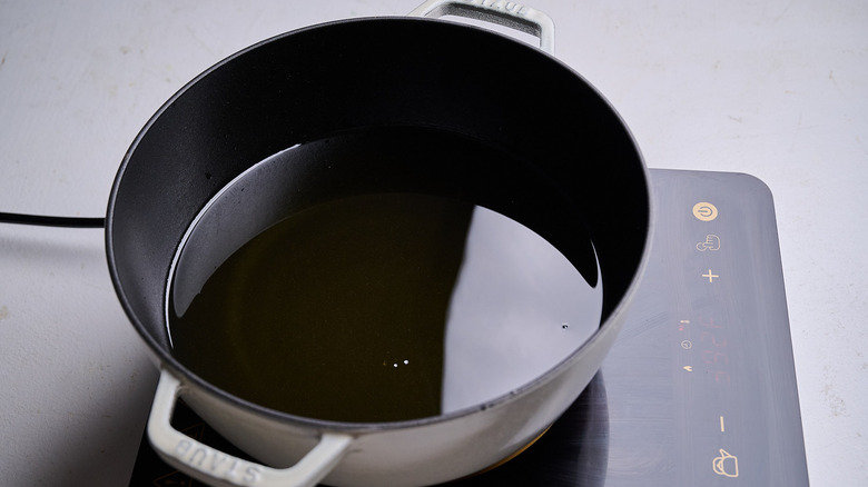 heating oil in a pot