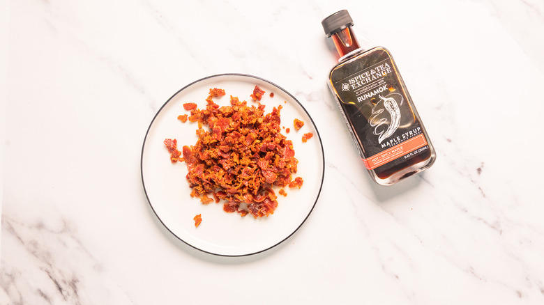Bacon next to maple syrup
