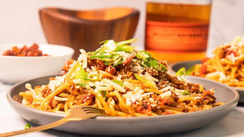 Side view of a plate of bourbon-infused cowboy spaghetti
