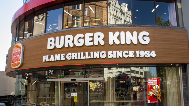 The exterior of a Burger King restaurant is pictured with the marketing phrase: 