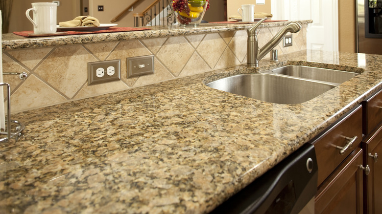 A brown speckled granite kitchen countertop
