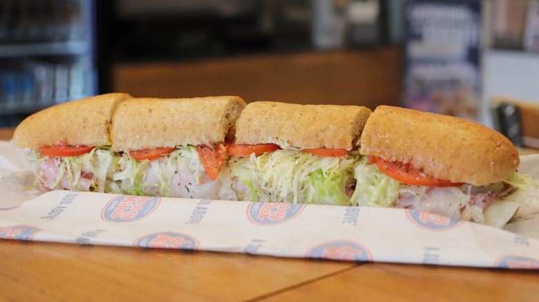 Jersey Mike's sandwich with freshly baked bread sliced on top