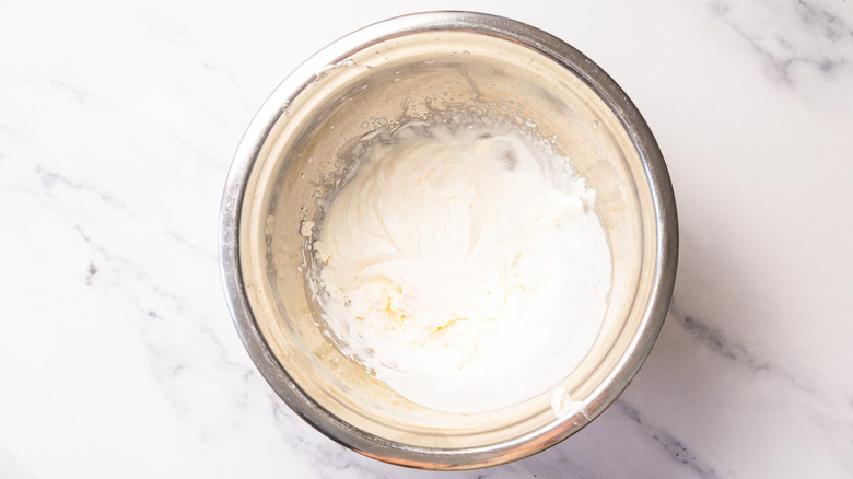 Whipped cream in metal bowl