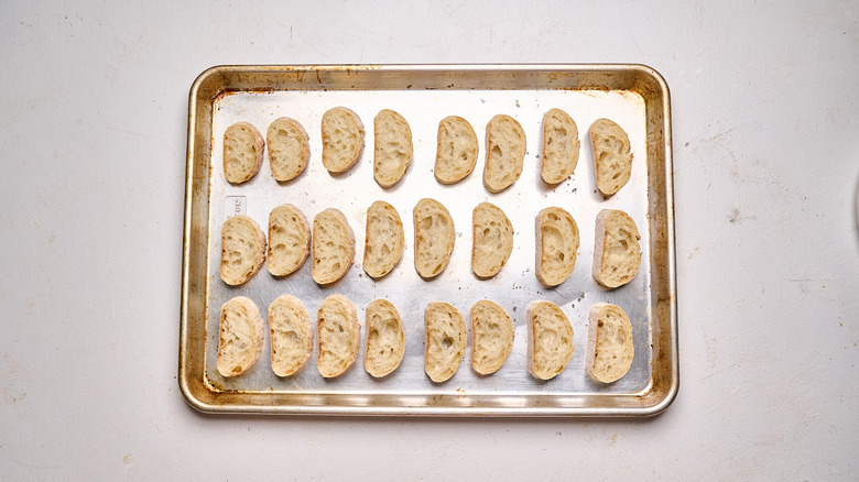 crostini arranged on a baking sheet