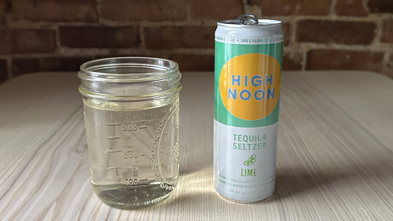 Lime High Noon on table with glass