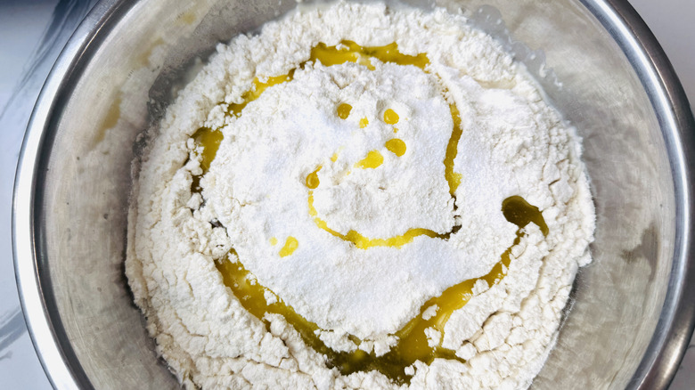 Flour with drizzle of oil in bowl