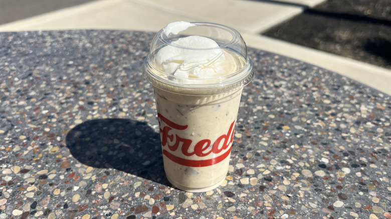 Freddy's Peanut Butter Bananza Concrete on an outside table