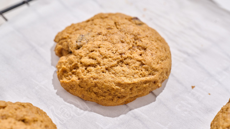 pumpkin cookie cooling on a wire rack