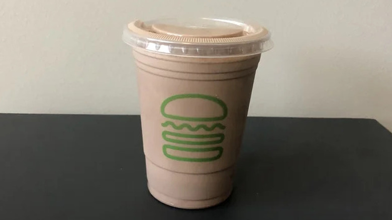Shake Shack chocolate milkshake in a to-go cup
