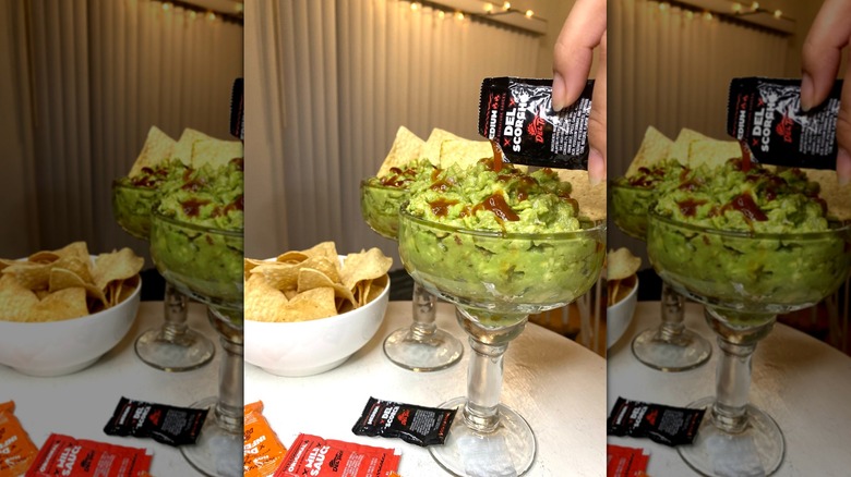 Del Taco guacamole in goblet with hot sauce