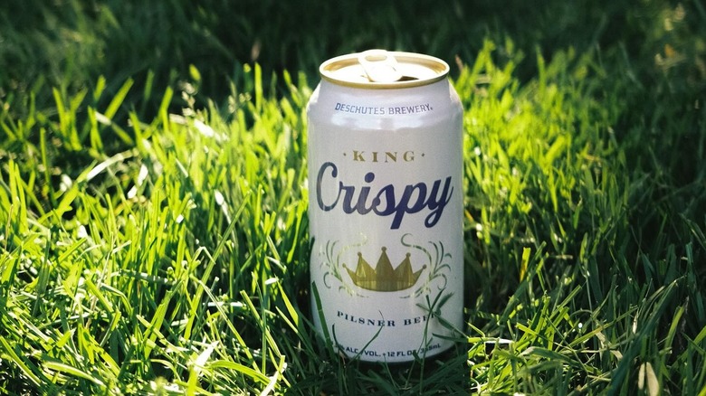 Can of King Crispy in the grass