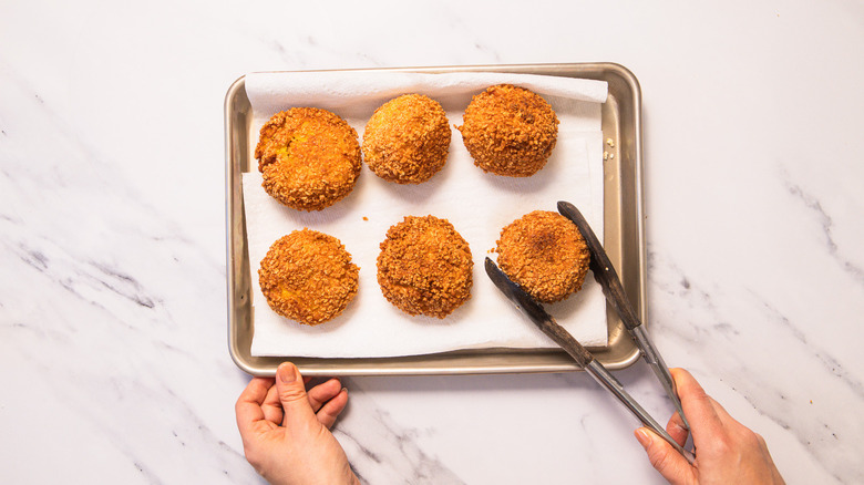 Fried arancini on baking sheet