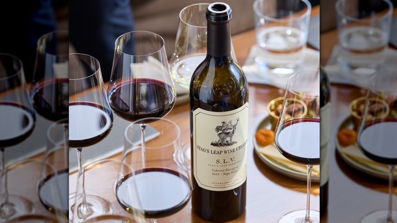 Bottles and glasses of 2023 Stag's Leap Wine Cellars S.L.V. Cabernet Sauvignon