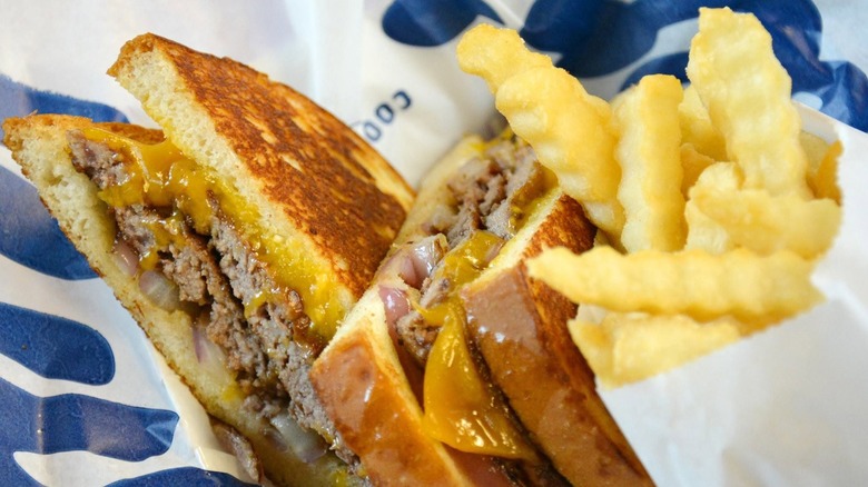 The sourdough melt and crinkle cut fries from Culver's on branded wrapping paper