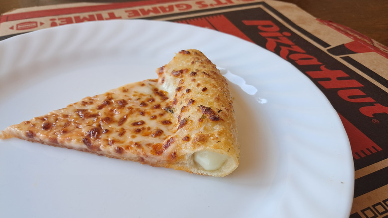 Side view of stuffed crust with cheese oozing out
