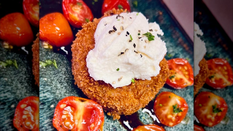 Crab cake with whipped mozzarella and cherry tomatoes