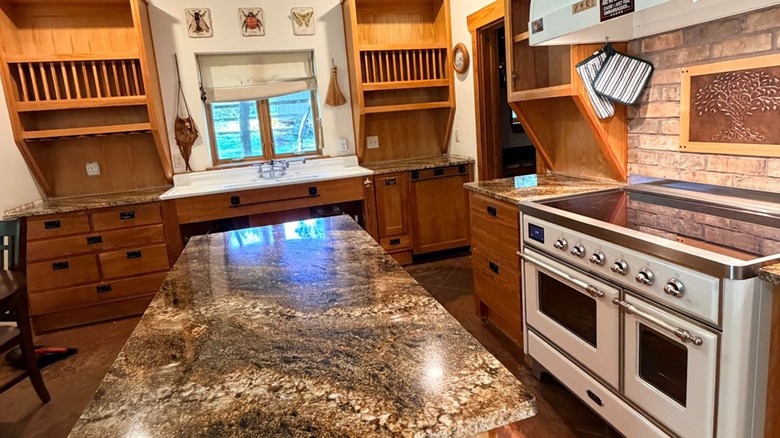 Desert Dream granite countertops in a kitchen with honey oak cabinets