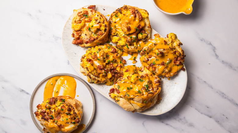 Eggs benefict rolls with hollandaise sauce