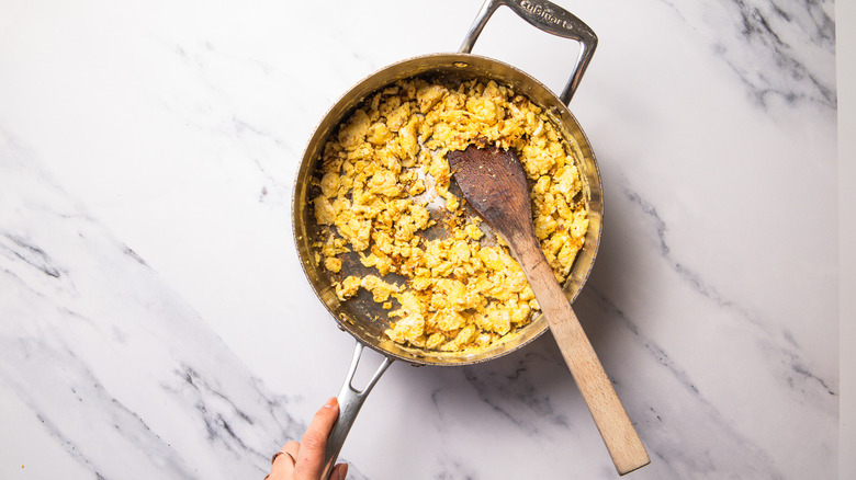 scrambling eggs in pan
